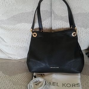 Michael Kors purse with dust bag and strap.